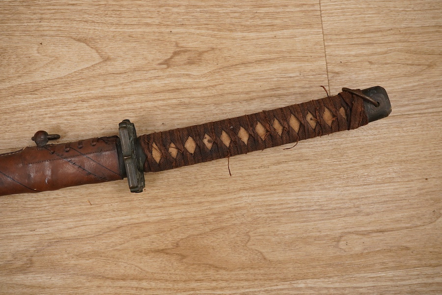 A Japanese WWII Shin gunto (sword) and leather mounted scabbard